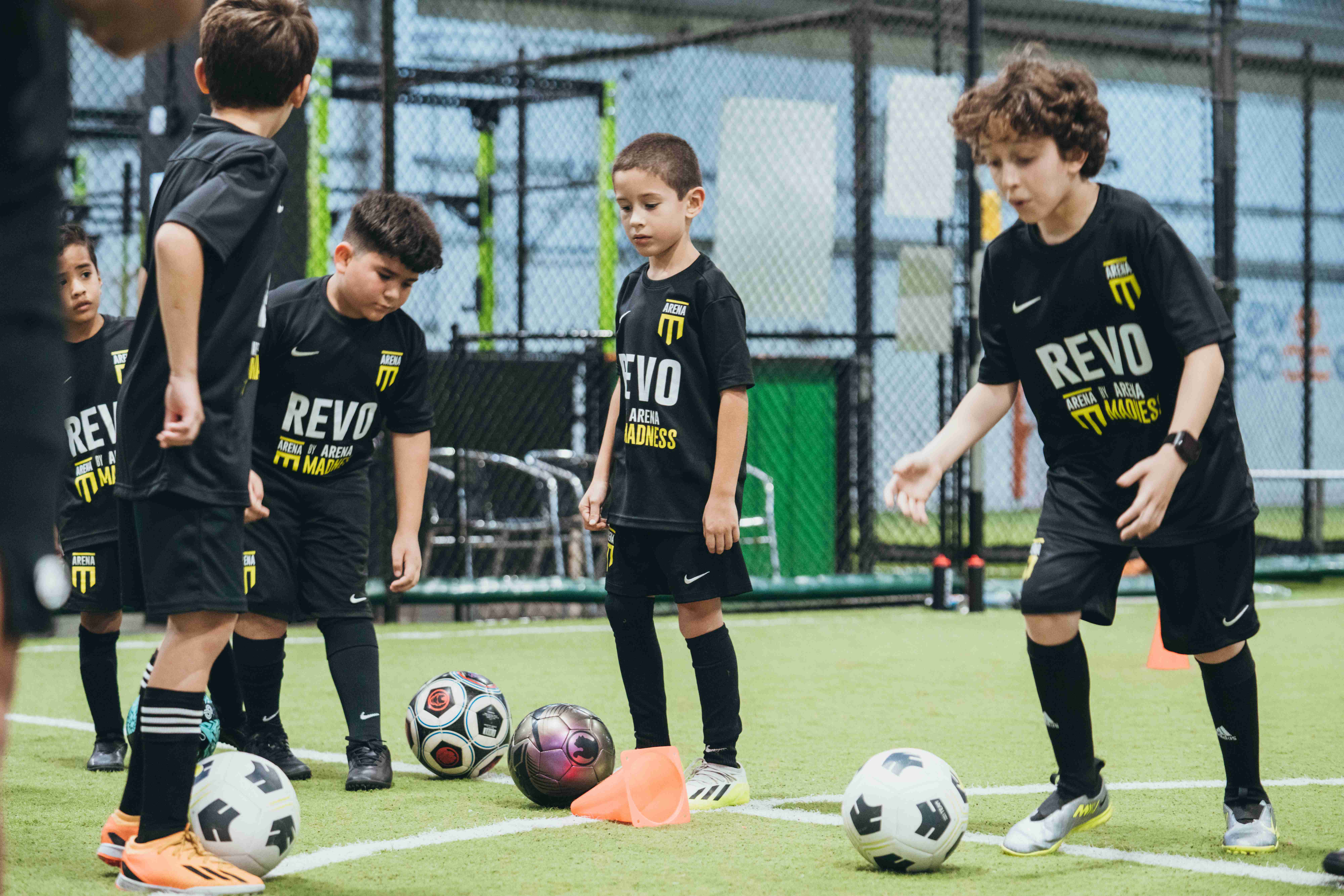 Youth academy training session with children in Revo uniforms